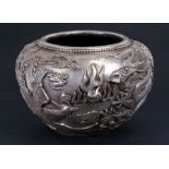 A large Chinese silvered bronze censer decorated in relief with a dragon and phoenix, four character