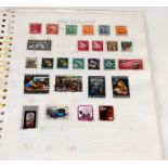 A stamp album containing Great Britain and Commonwealth stamps.
