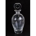 A Lalique glass decanter with stylised stopper having an open ring centre, etched signature to the