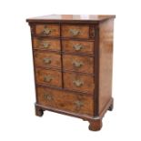 An 18th century style figured walnut two-door TV cabinet, 73cms (28.75ins) wide.