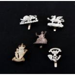 Five silver plated Military cap badges: The Kings Own Royal Regiment (Lancaster), The Buffs (Royal