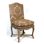 A Louis XVI style upholstered open armchair.