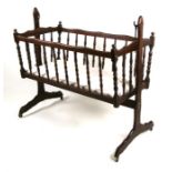 A stained beech bassinet.