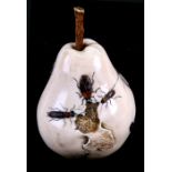 A carved ivory study of a pear with shibayama insect decoration in horn and shell, 8cms (3ins)