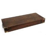 An oak gun case with brass corners and carrying handles, 83cms (32.5ins) wide.