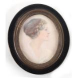 Arthur Royce Bradbury ARWA (British 1892-1977) an oval bust portrait miniature depicting a young