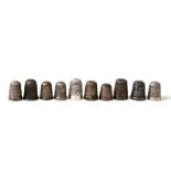 A group of silver and white metal thimbles (10).