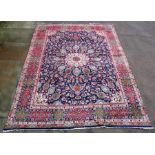 A fine Persian Tabriz woollen hand knotted carpet decorated in the Gonbad design with central