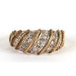A 9ct gold dress ring set with bands of white stones, approx UK size 'O', 4.9g.