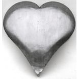 A wall mounted polished steel heart, 54cms (21.25ins) high.