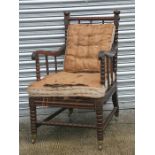 A William IV mahogany bobbin turned open armchair.Condition Reportgeneral wear, back legs have old