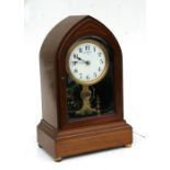 An early 20th century Eureka Electric Co. Ltd., London mantle clock designed by Timothy Powers, a