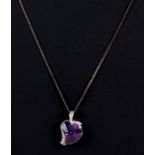 A 9ct white gold amethyst pendant on chain, cased.