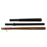 A late Victorian / Edwardian ebony truncheon, 54cms (21ins) long; together with two similar