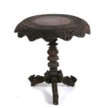 A Burmese carved hardwood tripod table, 70cms (28ins) diameter.Condition Reporttop detached from