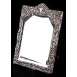 A silver framed strut mirror, indistinct Birmingham hallmark lower left, 19 by 27cms (7.5 by 10.