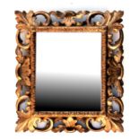 A Florentine style carved giltwood mirror, 32cms (12.5ins) wide.