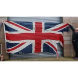 A large cotton Union Jack flag; together with a large St Georges Cross flags and other flag (a/f).(