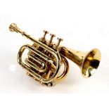 A Boosey & Co. brass soprano cornet with mouthpiece.