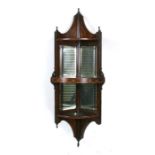 An Edwardian inlaid rosewood mirror backed corner wall shelf, 34cms (13.5ins) wide.
