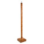An Art Deco blonde mahogany standard lamp with square stepped base, 170cms (67ins) high.Condition