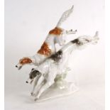 A Hutschenreuther (Germany) porcelain group in the form of running Borzois, modelled by K Tutter,