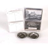 A quantity of assorted WWI postcards to include tanks, battle scenes and two pin trays.