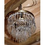 An Edwardian chandelier with glass prismatic drops, 20cms (8ins) diameter.Condition ReportComplete