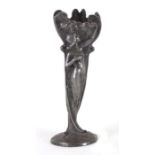 An Art Nouveau pewter vase decorated with Eve plucking the apple, 25cms (9.5ins) high.Condition