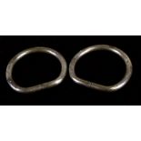 A pair of Chinese white metal (not tested) bangles, each with four character stamped mark, 7.5cms (