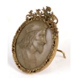 A 19th century style Italian lava cameo portrait depicting a Venetian gentleman, in a gilt strut