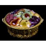 A Sarreguemines majolica tureen and cover in the form of a basket of fruit, 21cms (8.25ins)