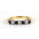 An 18ct gold diamond and sapphire diamond eternity ring, approx UK size 'M', weight 3.3g.Condition