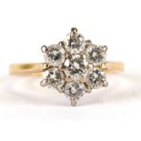 An 18ct gold diamond flowerhead cluster ring, approx UK size 'J', 2.6g.Condition ReportGood