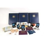 Three folders of the Queen's Golden Jubilee Coin First Day covers; together with a quantity of proof