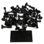 A large quantity of turned ebony candlesticks together with an ebony dressing table tray.