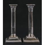 A pair of Victorian silver Corinthian column candlesticks, loaded, Hawksworth Eyre & Co Ltd (1885-