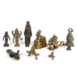 A group of Indian brass and bronze temple figures, the largest 15cms (6ins) high.