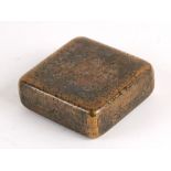 A Chinese brass ink box decorated with calligraphy, 7.5cms (3ins) wide.