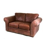 A modern brown leather two-seater sofa (reputedly bought from Habitat) 160cms (63ins) wide.