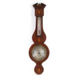 An Edwardian wall barometer with thermometer in a mahogany case with shell inlaid decoration,