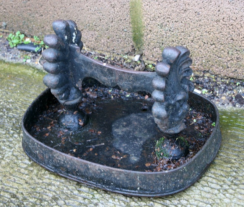 A 19th century cast iron boot scraperCondition Report35cm wide. 28cm deep. 24cm high, the mud