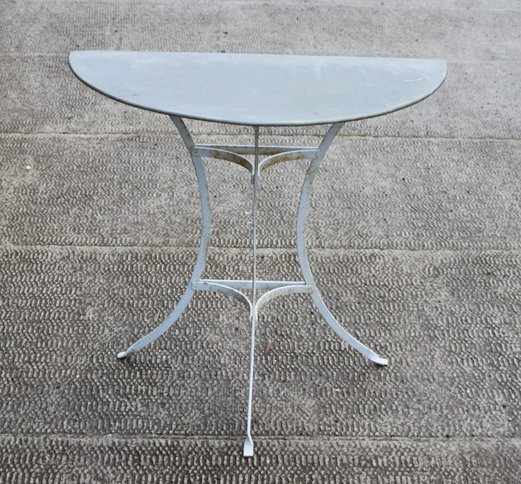 A painted metal garden table with zinc demi-lune top, 79cms (31ins) wide.Condition ReportGood