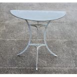 A painted metal garden table with zinc demi-lune top, 79cms (31ins) wide.Condition ReportGood