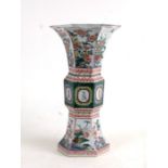 A Chinese famille vert six sided Gu shaped vase with flared rim, six character blue mark to the