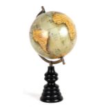 A terrestrial globe on a turned stand, 40cms (15.75ins) high. (modern)