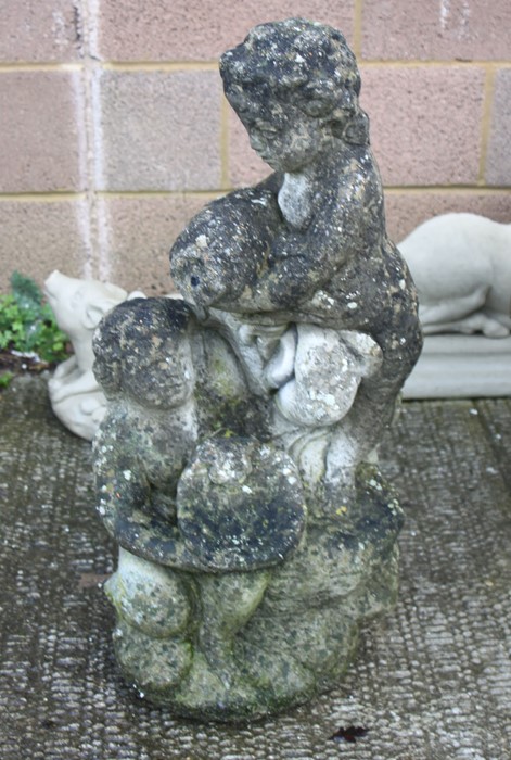 A well weathered reconstituted stone garden fountain, 75cms (29.5ins) high.Condition Reportwell