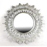 A modern silvered circular wall mirror, 42cms (16.5ins) diameter.