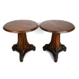 A pair of late 19th century style style carved oak pedestal tables with triform bases and acanthus