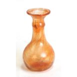 A Clutha type Christopher Dresser design style amber glass vase, 12cms (4.25ins) high.Condition